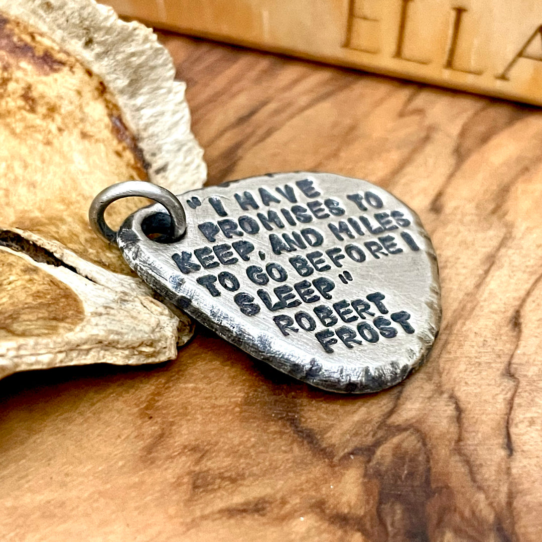 Engraved Guitar pick pendant with rustic edges and oxidized text. Sterling Silver and Oxidized to antique finish