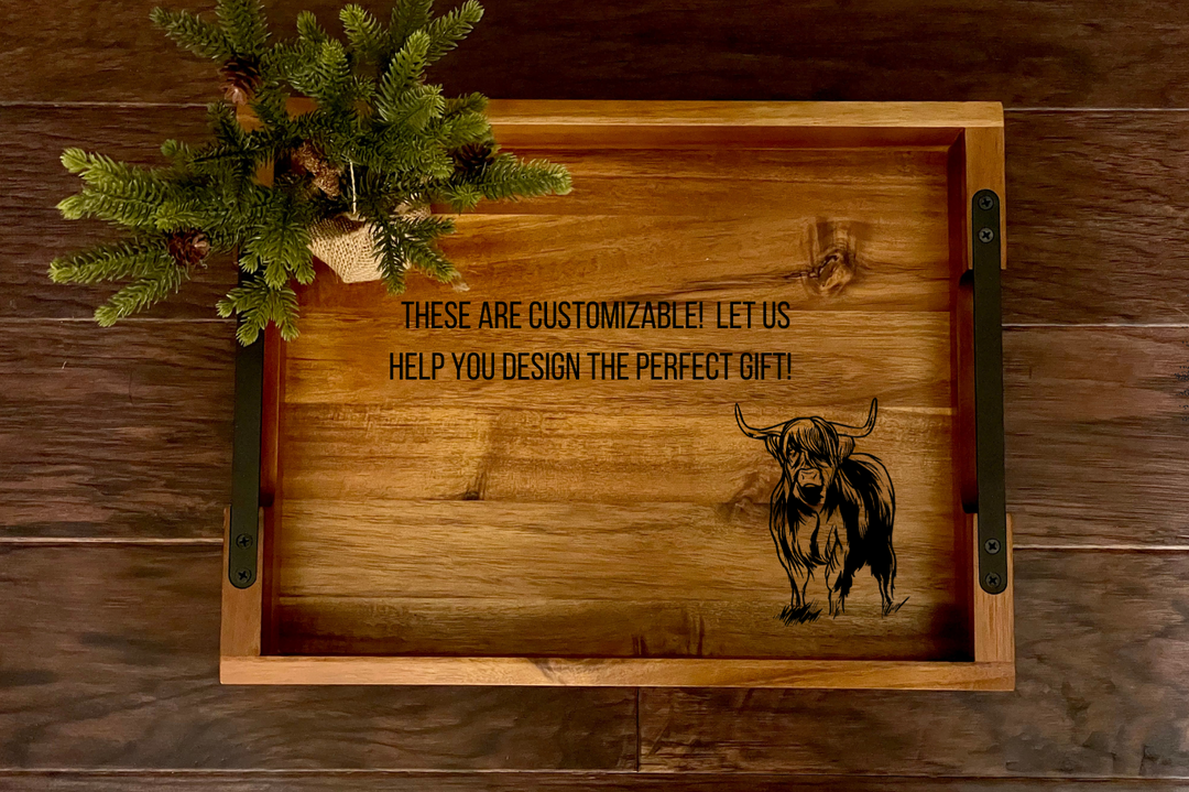 Personalized highland cow tray made of wood with black metal handles. On wood background