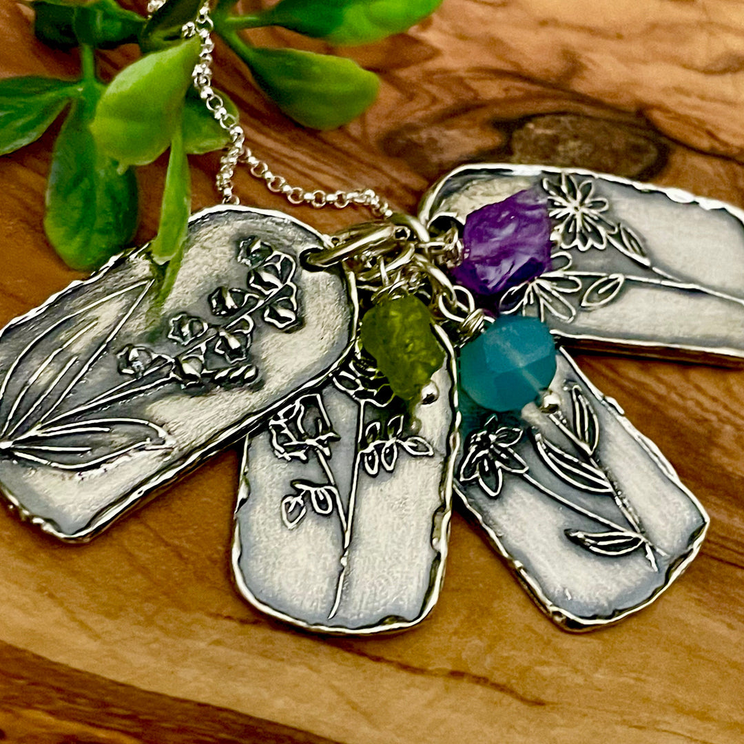 Hand carved artisan made birth month flower necklace with natural raw birthstone. 
