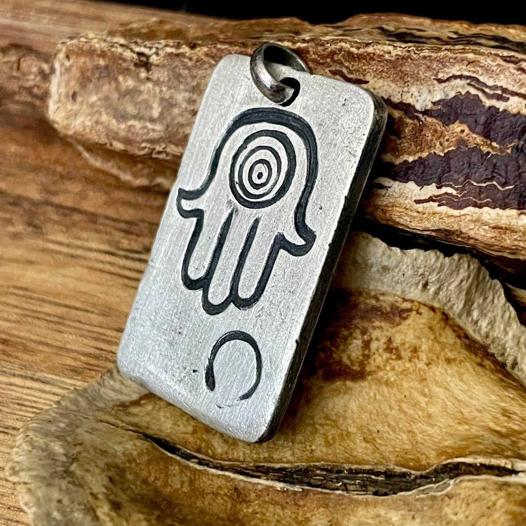 Rectangle sterling silver pendant handmade and carved with a hamsa hand and zen symbol. Personized with your by Ella Joli.