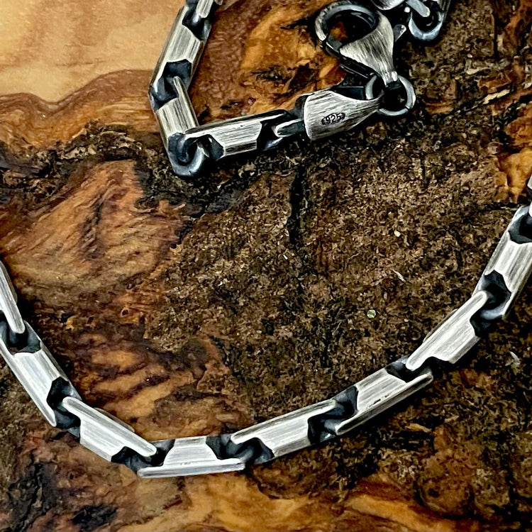 oxidized silver chain with strong bar links heshe style on wood background