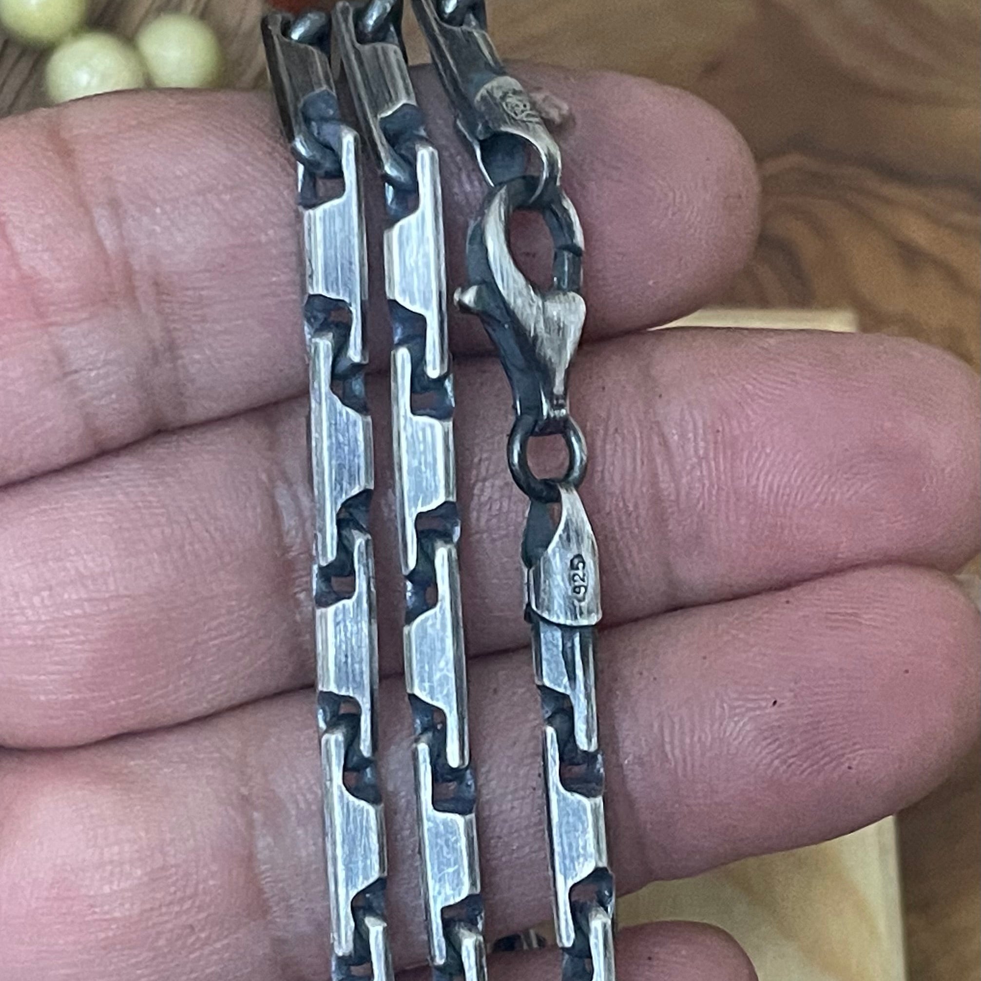 oxidized sterling silver heshe bar chain necklace in hand