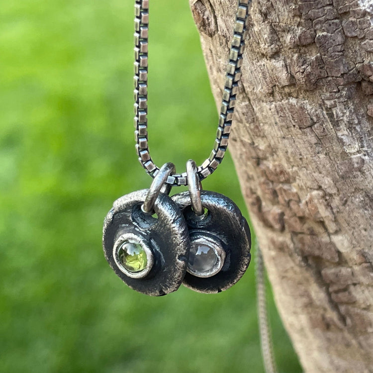 mens birthstone necklaces hanging on wood made of sterling Silver