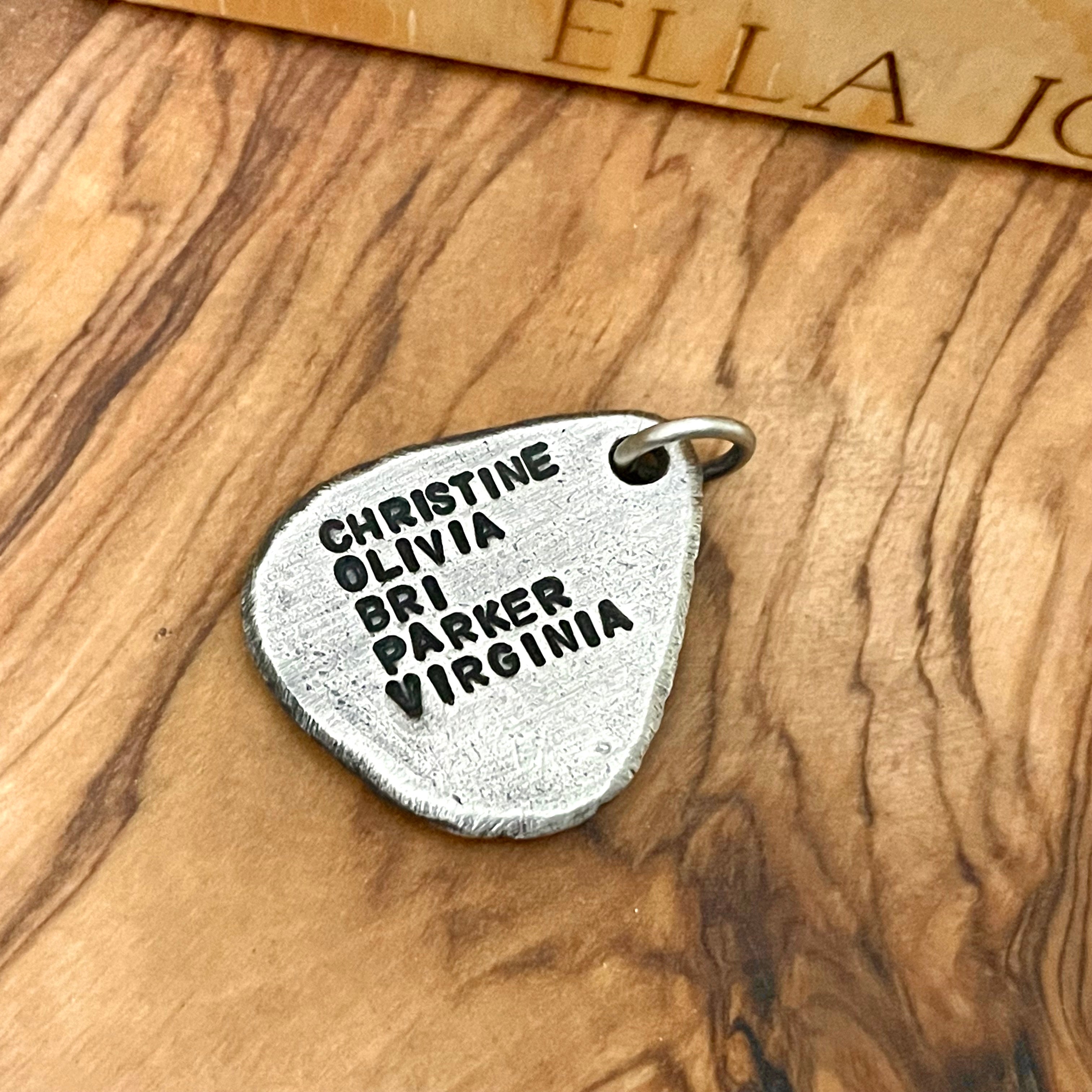 Sterling Silver guitar pick pendant with five names custom engraved on wood background