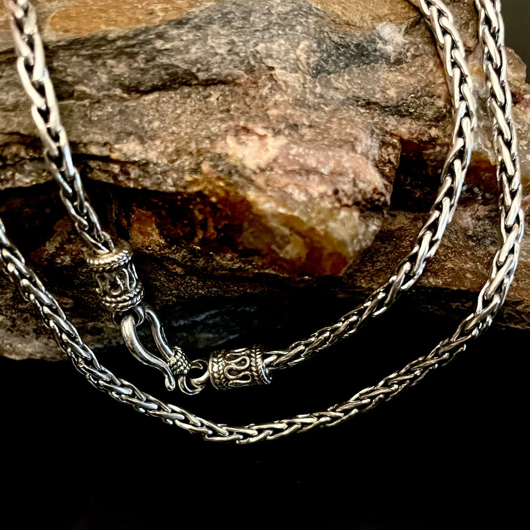 925 sterling silver Bali Spiga wheat chain oxidized 2.5mm specialty chains with decorative hook clasp. Shown on stone.