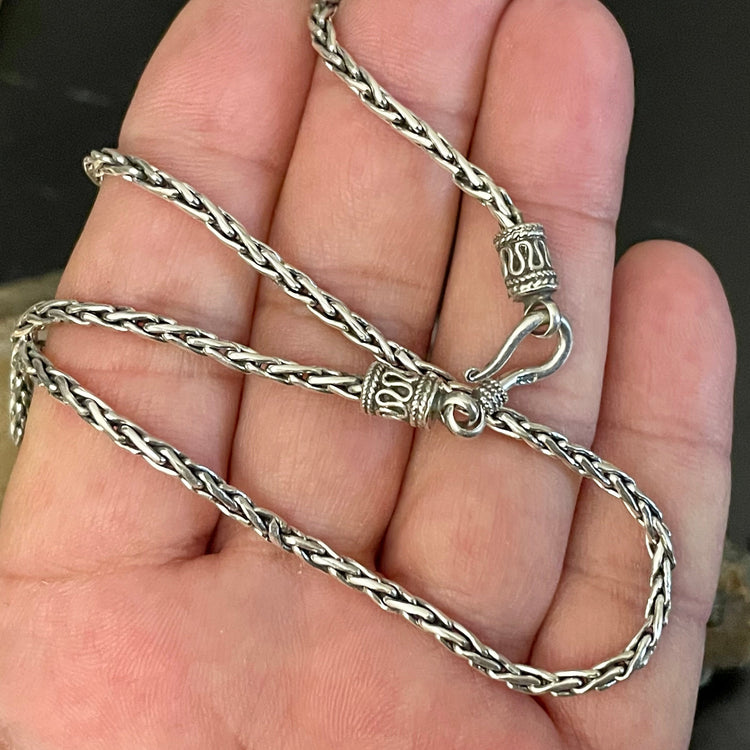 925 sterling silver Bali Spiga wheat chain oxidized 2.5mm specialty chains with decorative hook clasp. Shown on hand.
