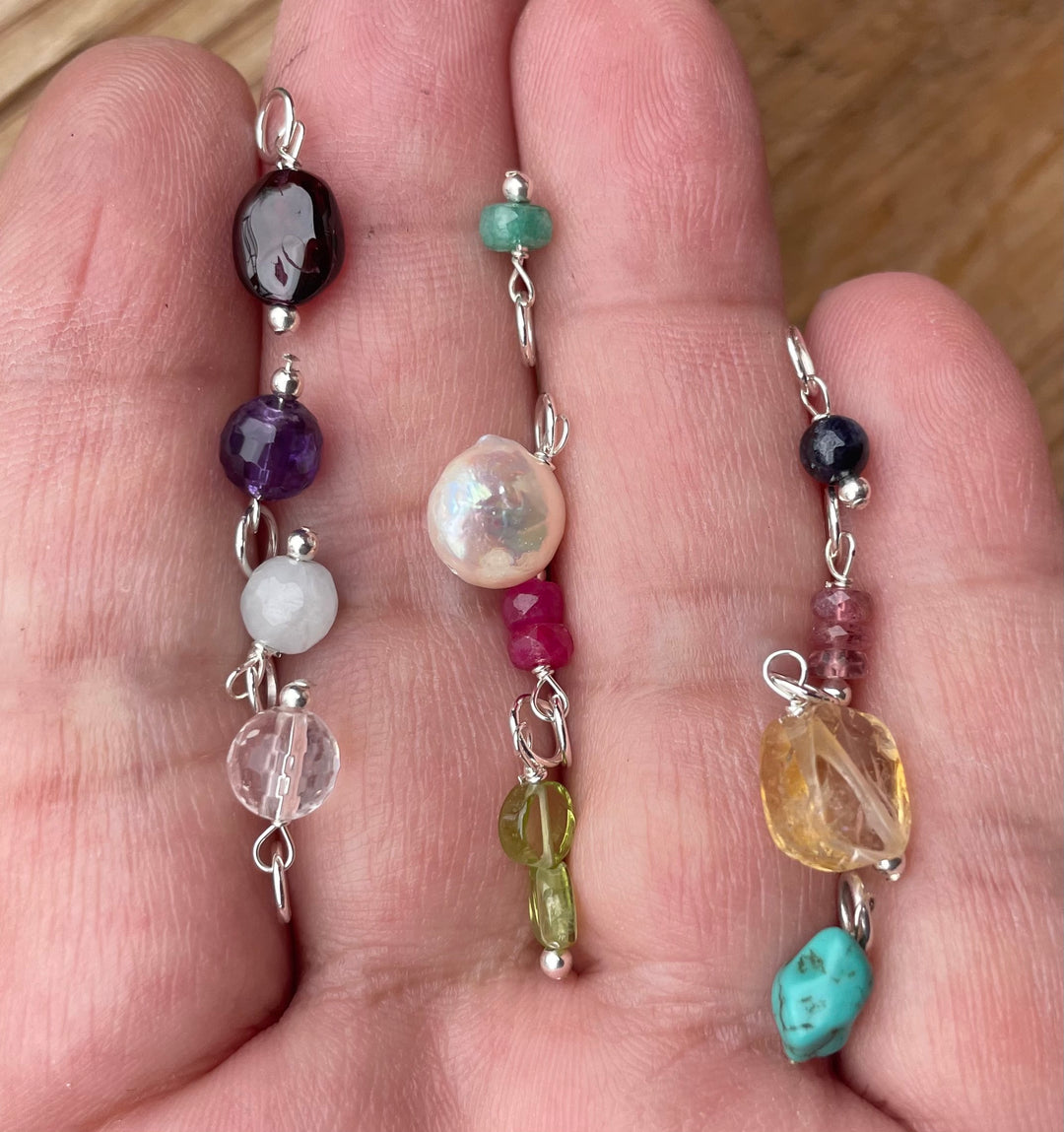 Birthstones options in hand. 