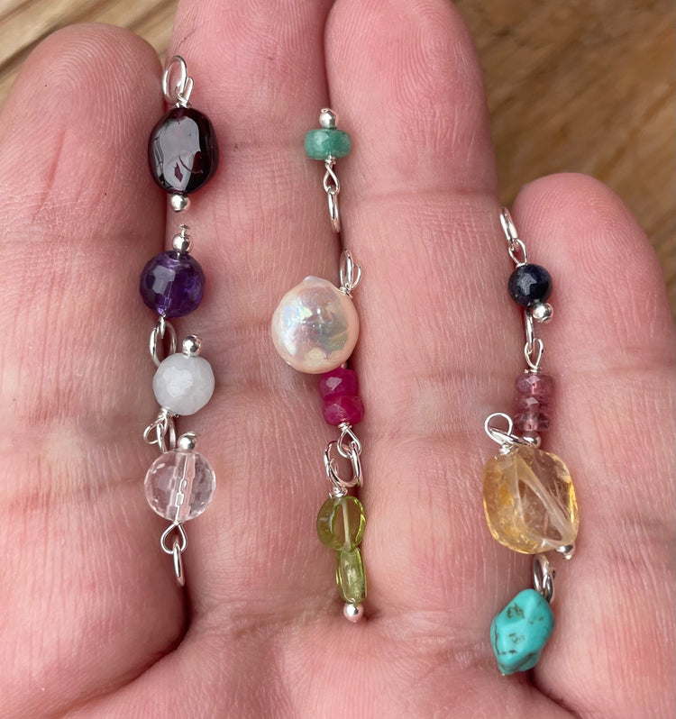 Birthstones options in hand. 