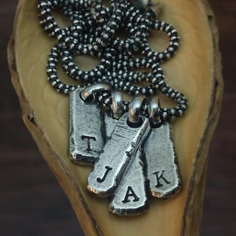 Four Oxidizaed Sterling Silver Initial Bar Tags and 1.8mm Necklace Chain shown with example letters T, J, A, K engraved. 
